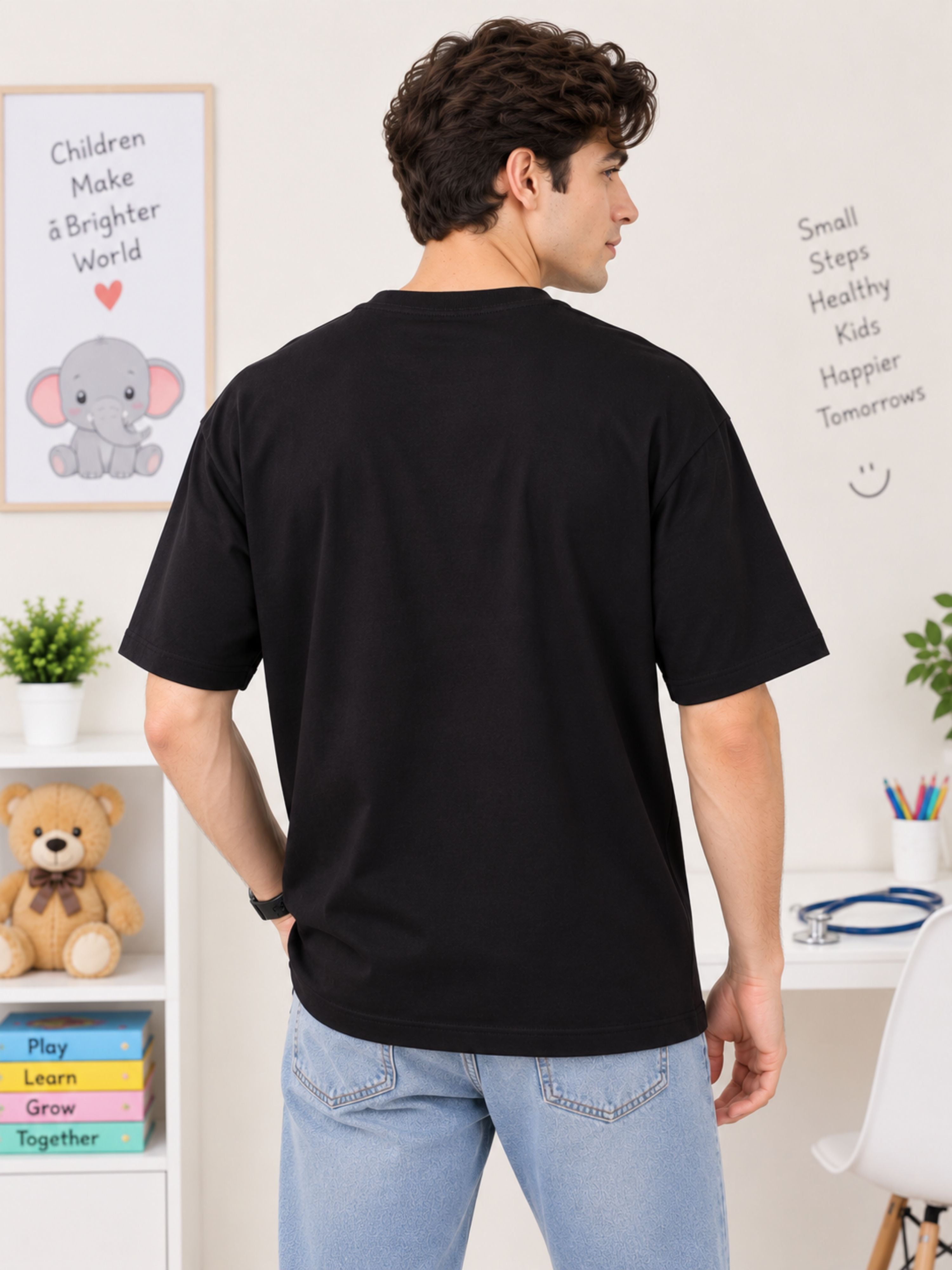 Back view of oversized fit Tshirt by Bandar Baant Collections worn by man Paediatrician Quote Tshirt For Men