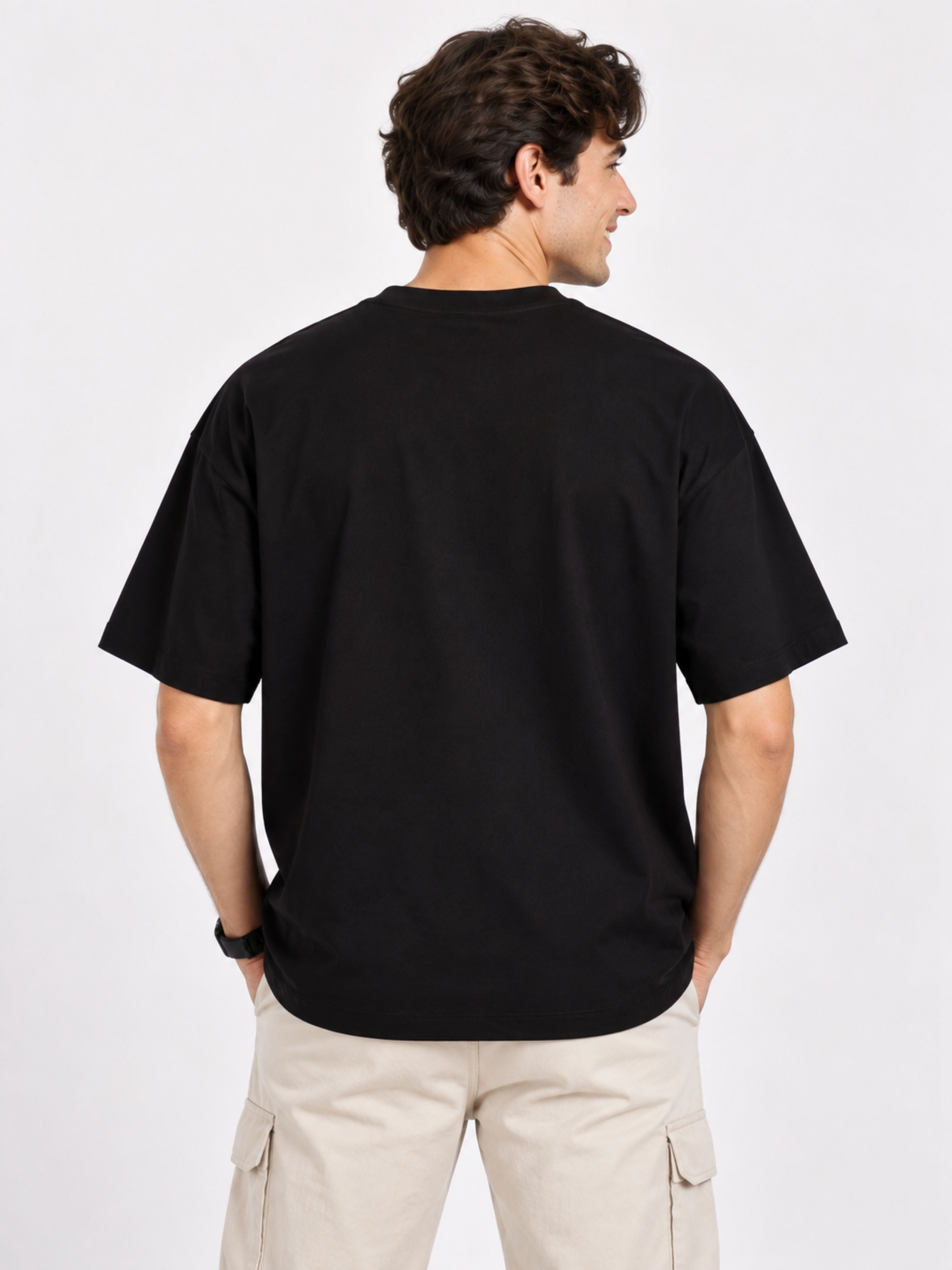 Back view of man wearing black oversized fit Pet Lovers T-shirt For Men paired with beige cargo shorts