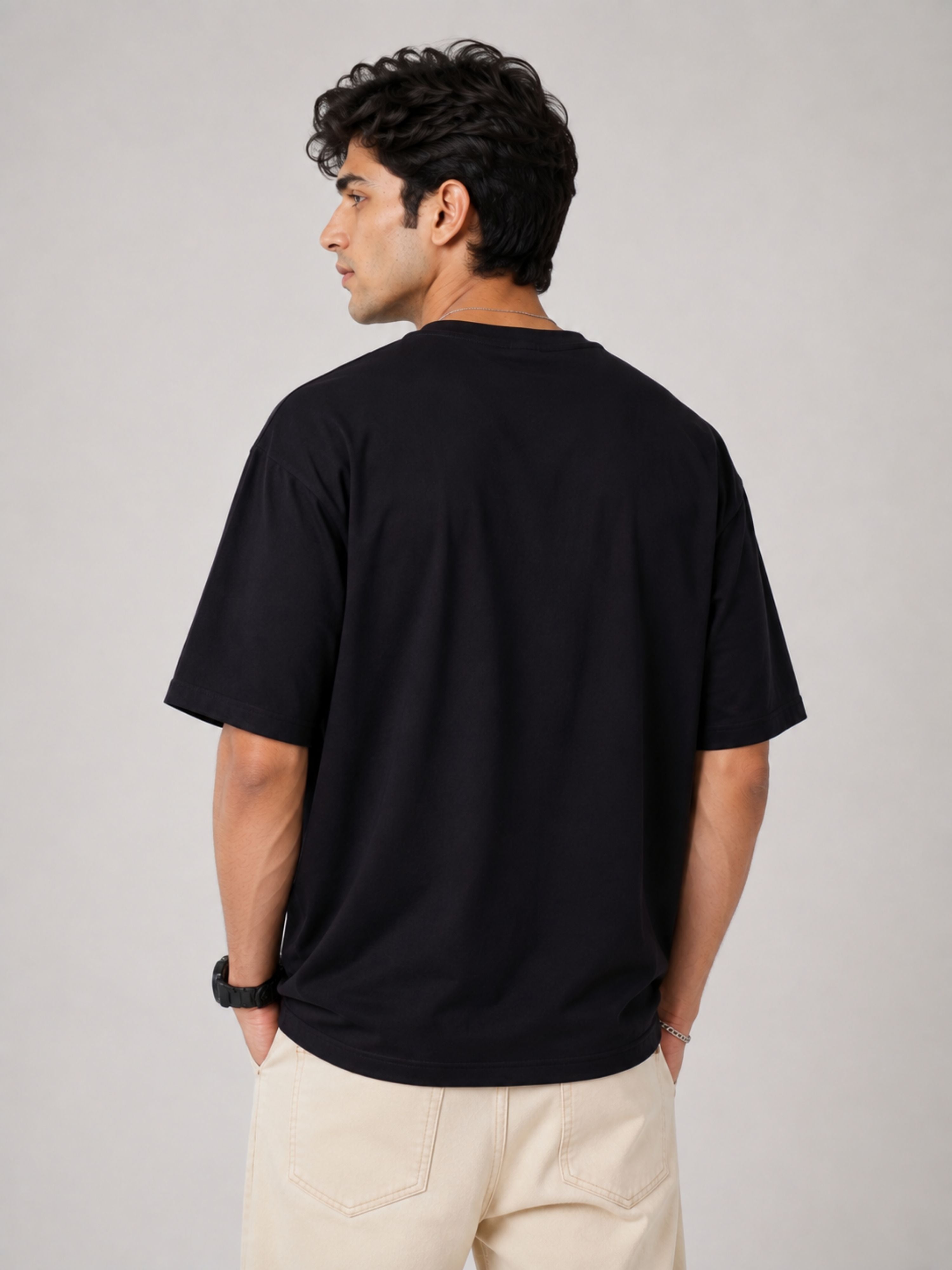 Back view of man wearing oversized fit Physician Cool Printed Tshirt For Men in black from Bandar Baant Collections