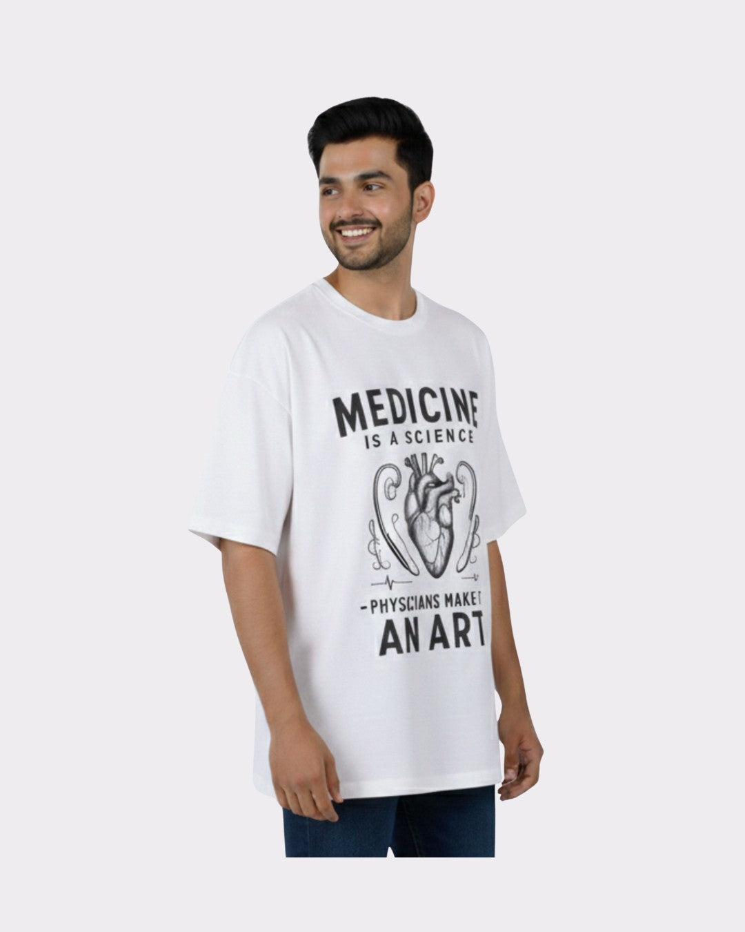 Physician Oversized Graphic Tshirt For Men white oversized fit t-shirt with medical artwork worn by smiling male model