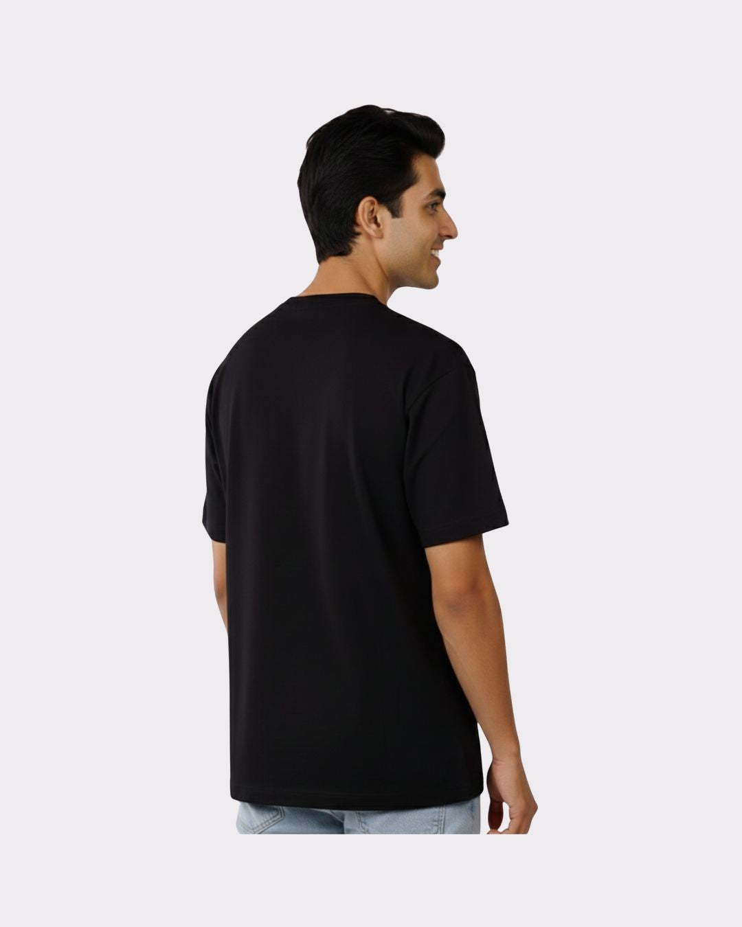 Back view of a man wearing a black Physician Oversized Tshirt For Men from Bandar Baant Collections