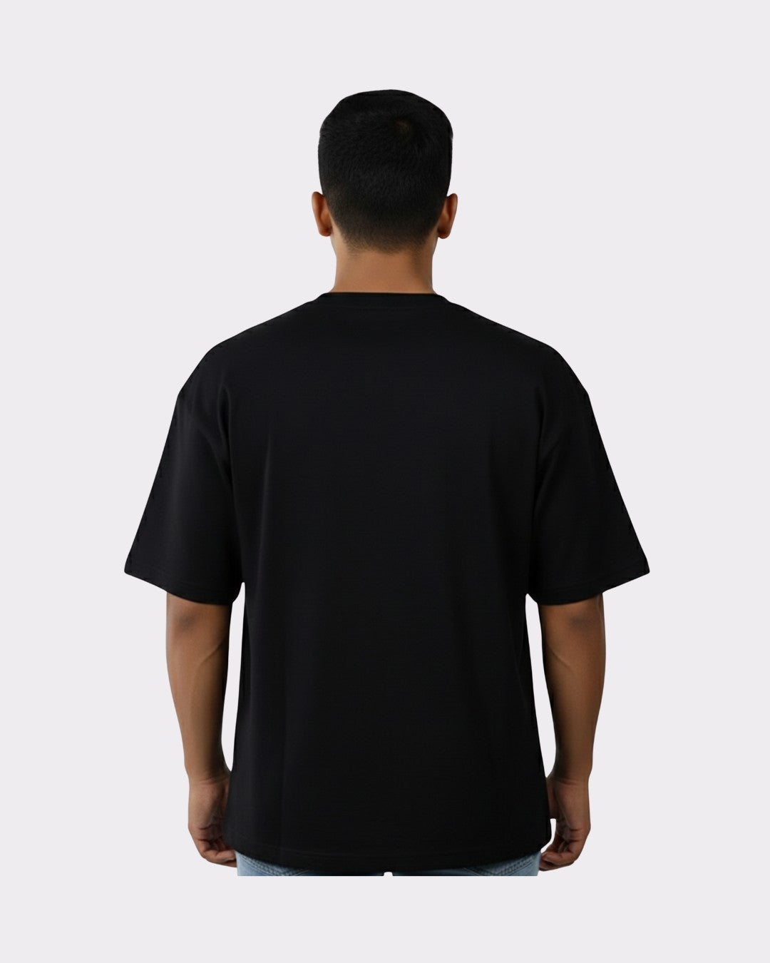 Back view of a man wearing a black Physician Oversized Tshirt For Men from Bandar Baant Collections