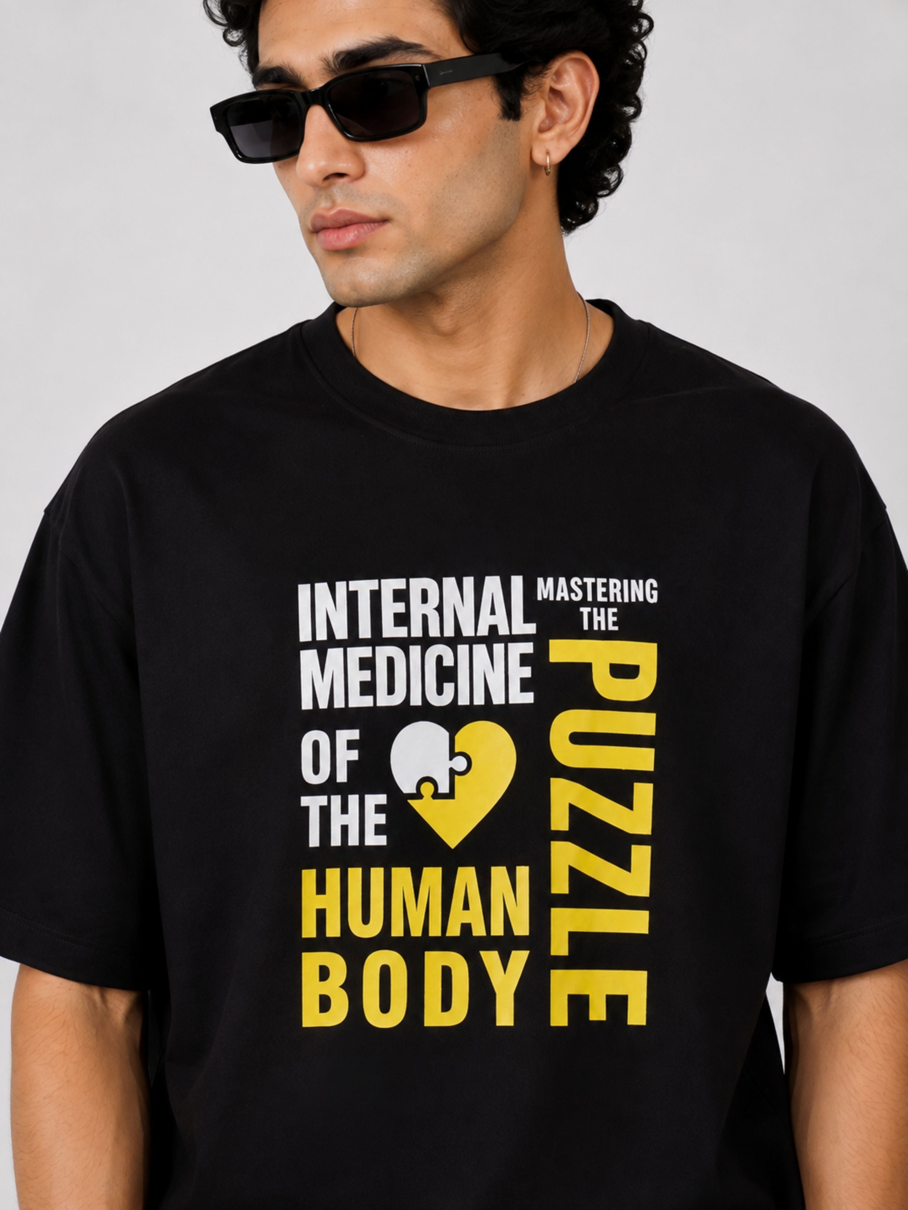 Black oversized fit Physician Tshirt For Men with Internal Medicine puzzle graphic by Bandar Baant Collections