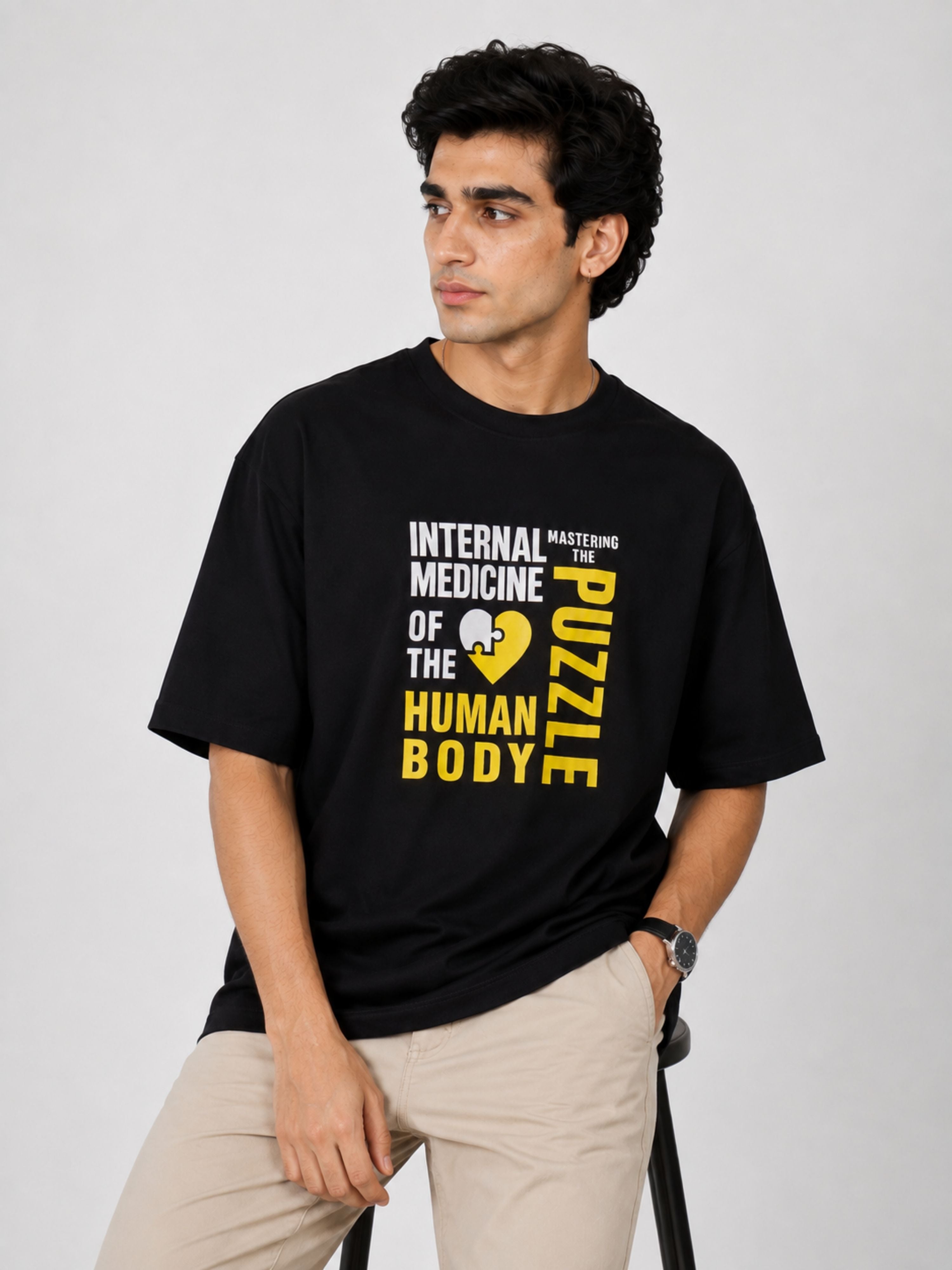 Black oversized fit Physician Tshirt For Men with medical puzzle graphic and text by Bandar Baant Collections