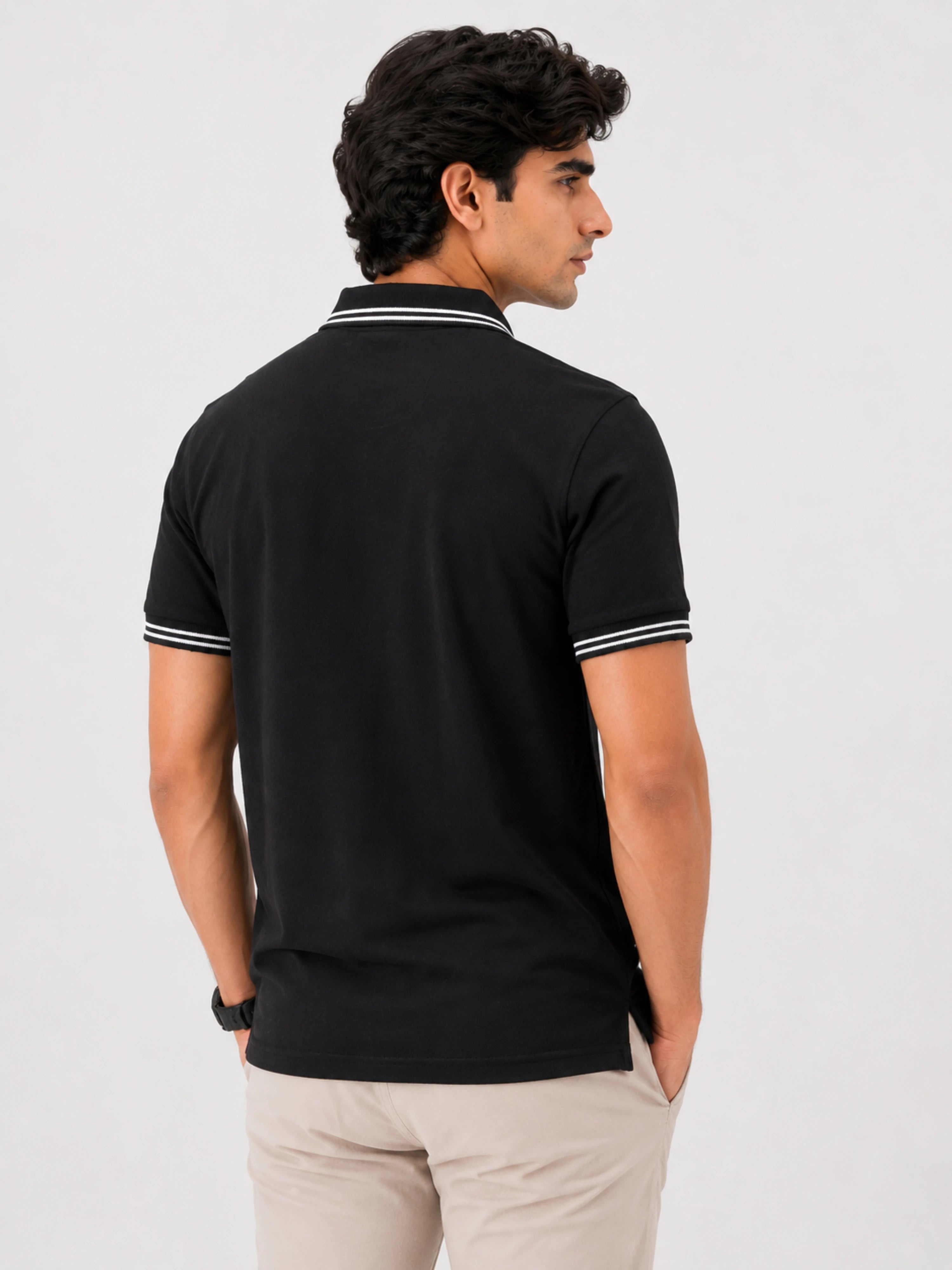 Back view of a man wearing a black Polo T-shirt For Men Black with white striped collar and sleeve trims