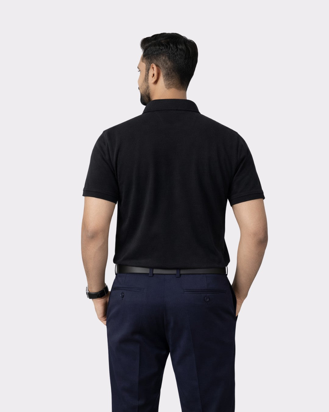 Back view of man wearing Premium Cotton Matty Polo T-Shirt for Men in black from Bandar Baant Collections
