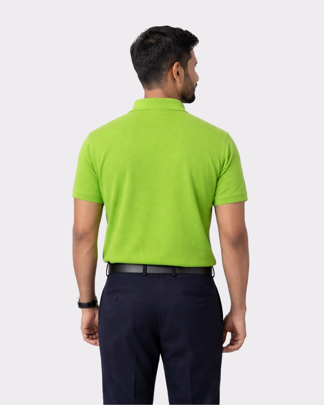 Back view of man wearing lime green Premium Cotton Matty Polo T-Shirt for Men from Bandar Baant Collections
