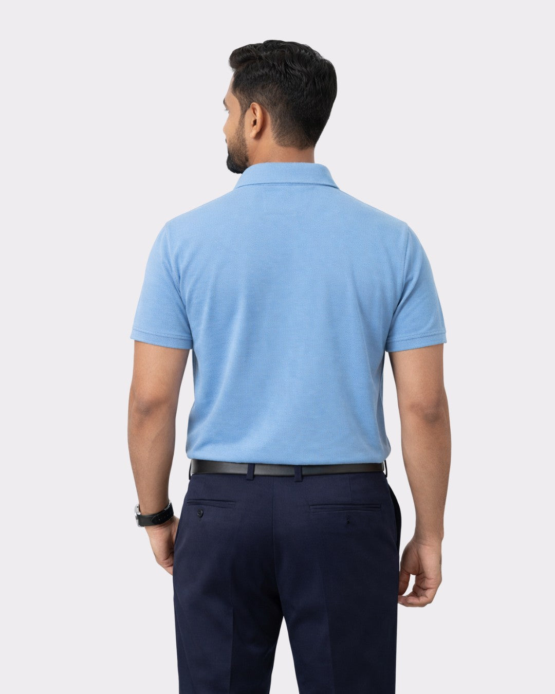 Back view of man wearing Premium Cotton Matty Polo T-Shirt for Men in light blue by Bandar Baant Collections