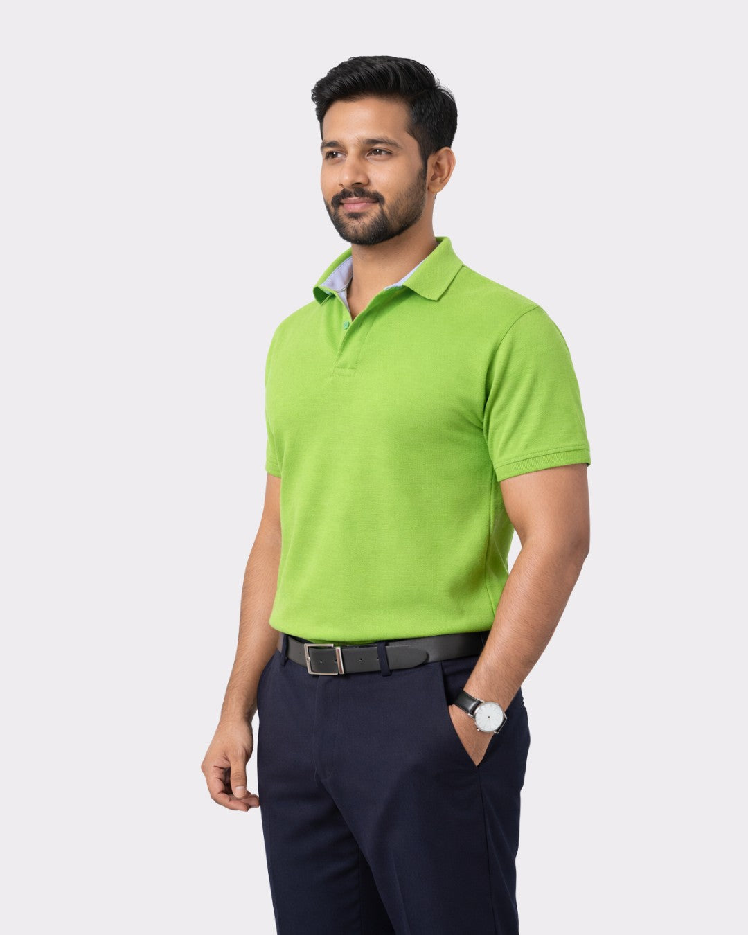 Man wearing lime green Premium Cotton Matty Polo T-Shirt for Men with black belt and navy pants
