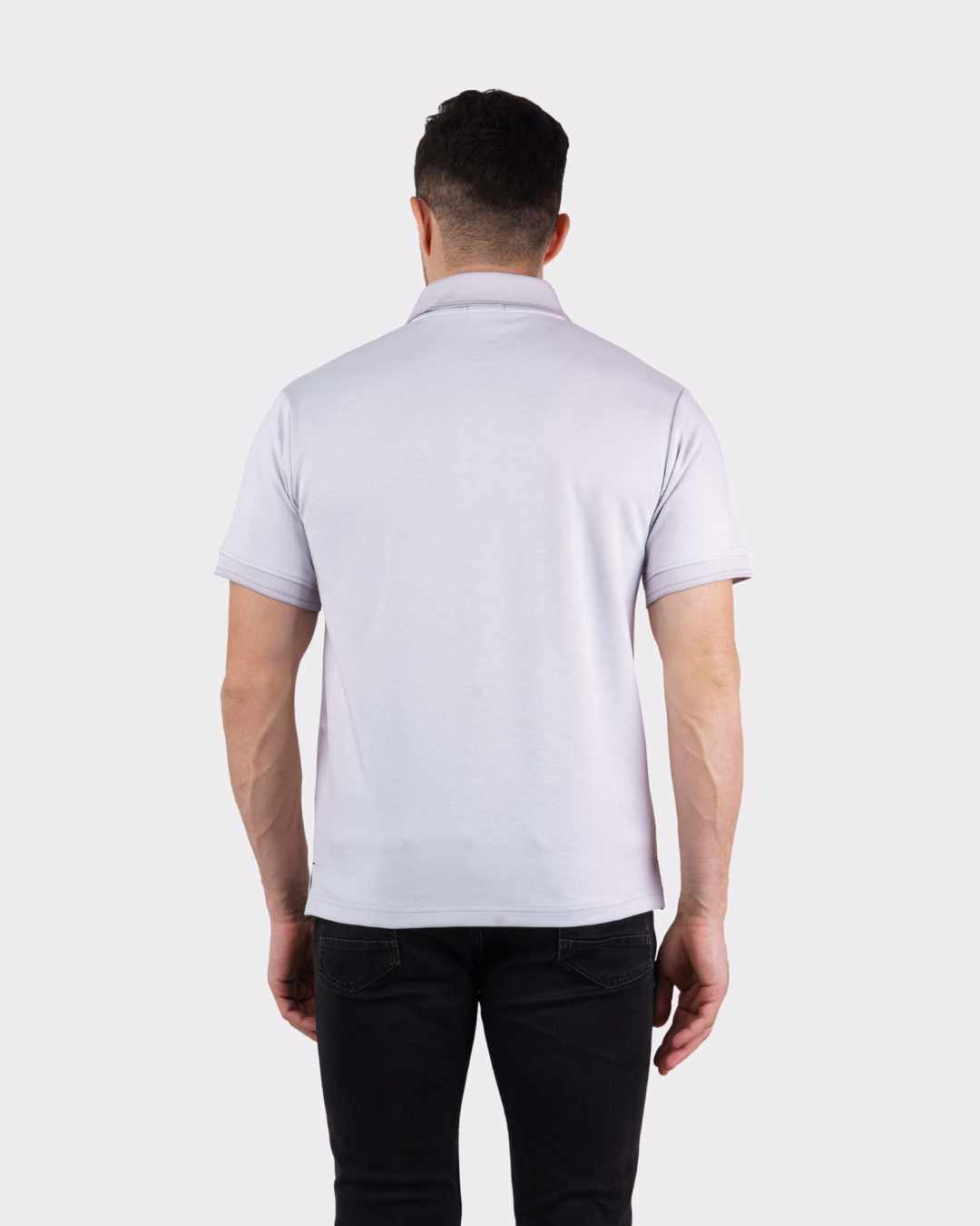 Back view of a man wearing a white oversized fit Premium Polo T-Shirt for Men by Bandar Baant Collections