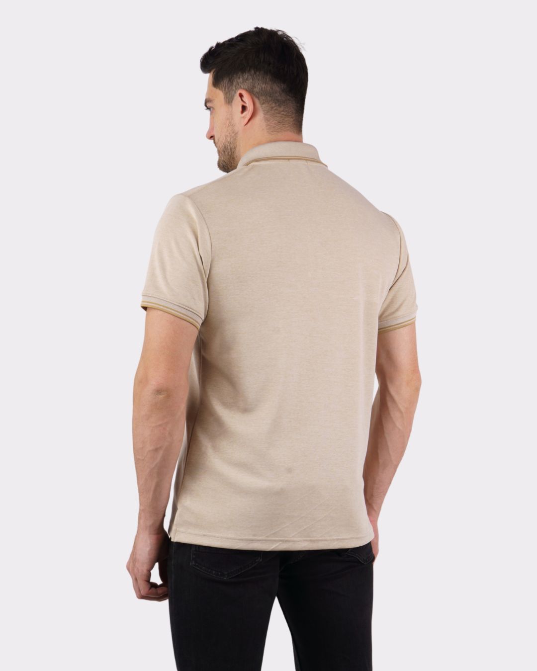 Back view of man wearing beige Premium Polo T-Shirt for Men from Bandar Baant Collections with oversized fit
