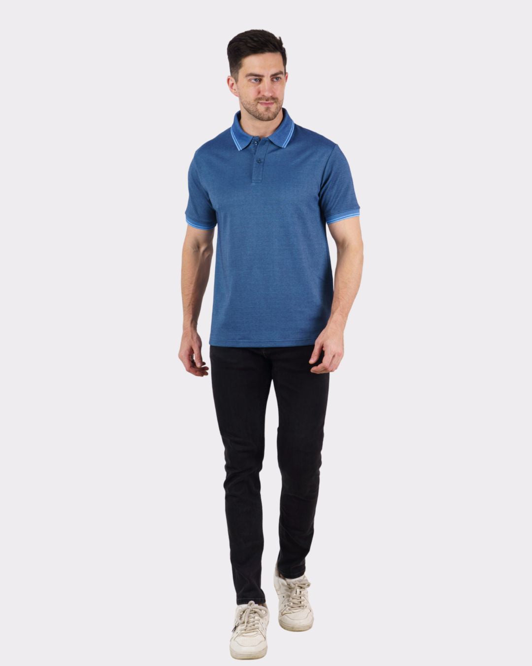Man wearing Bandar Baant Collections premium polo t-shirt for men in blue with black pants and white shoes