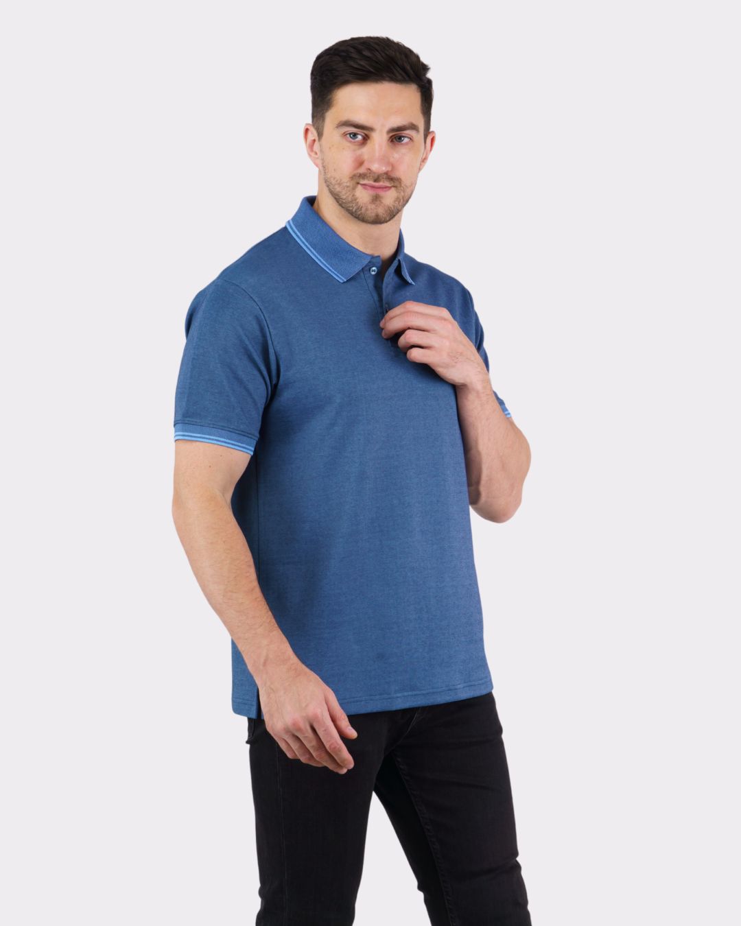 Man wearing a blue Premium Polo T-Shirt for Men from Bandar Baant Collections styled with black pants