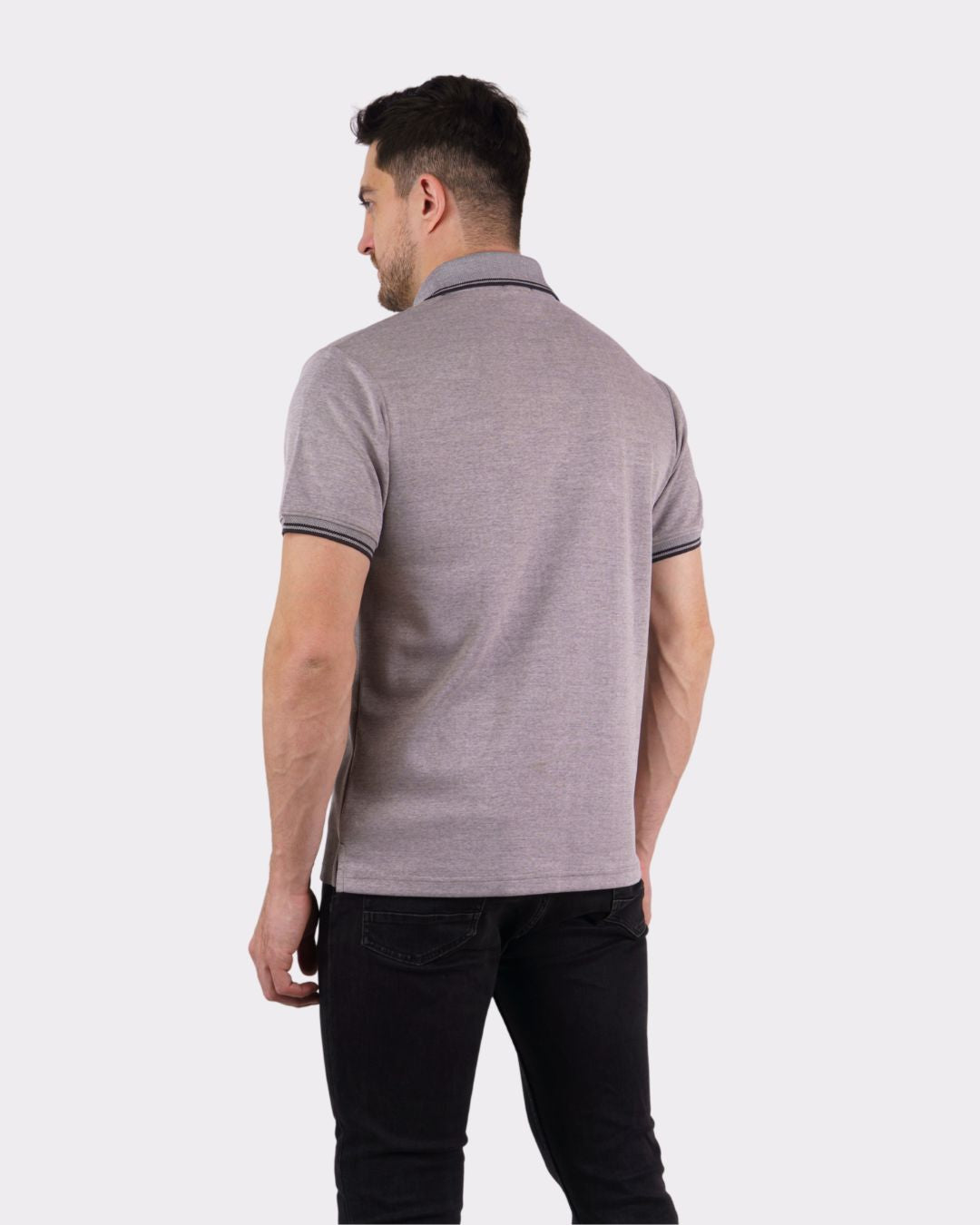 Back view of man wearing grey oversized fit Premium Polo T-Shirt for Men paired with black pants