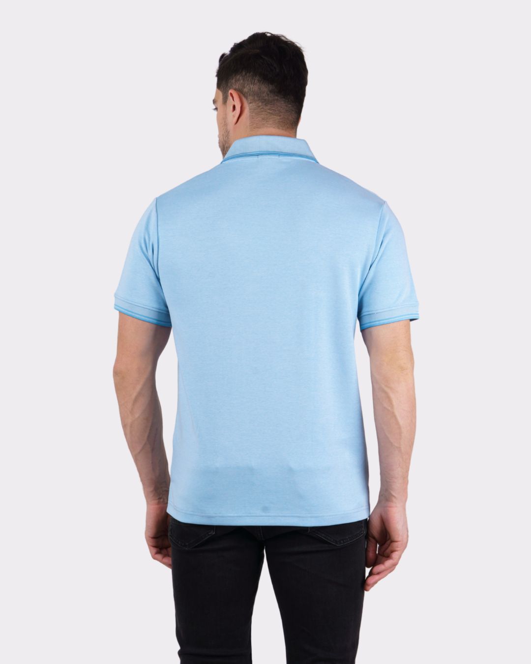 Back view of a man wearing light blue oversized Premium Polo T-Shirt for Men by Bandar Baant Collections