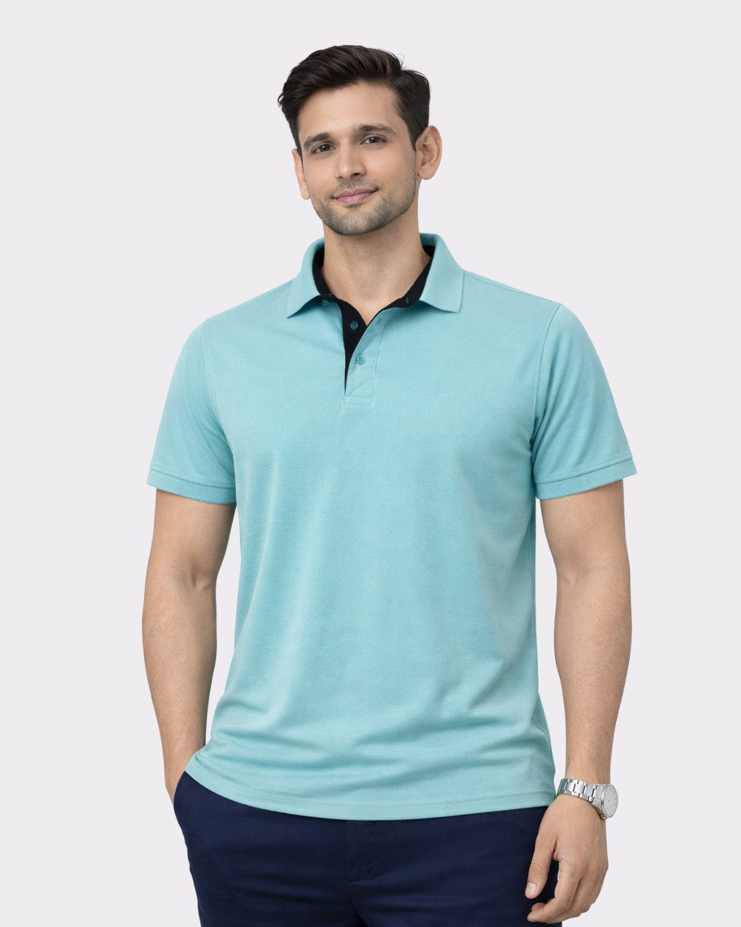 Man wearing a Premium Polo T-Shirt for Men in light blue with a black collar from Bandar Baant Collections