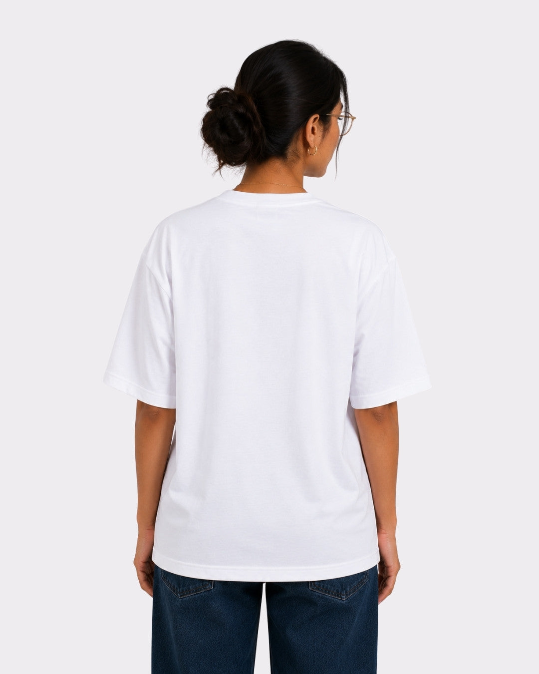 Back view of a woman wearing a white Psychiatrist Oversized T-shirt For Women from Bandar Baant Collections