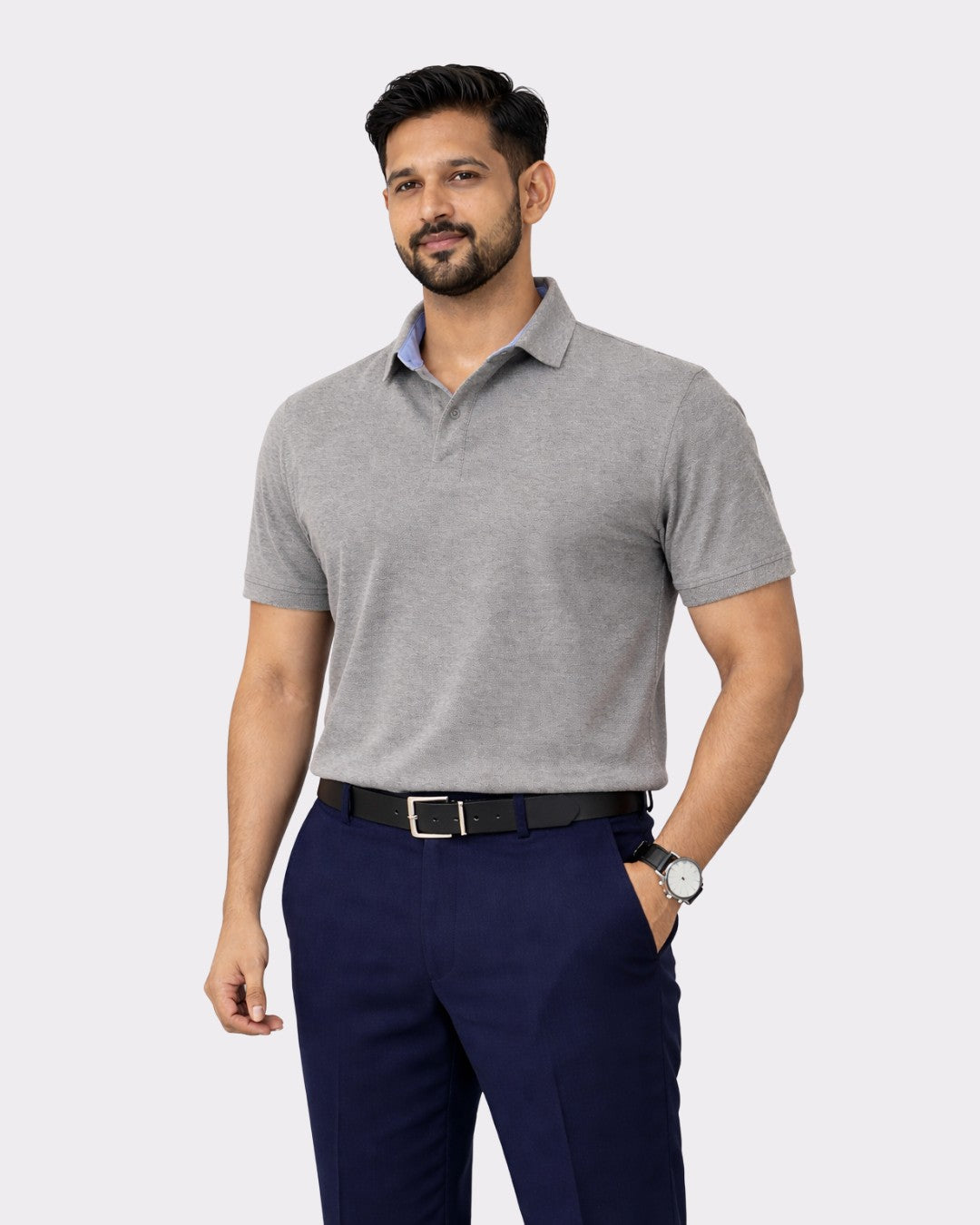 Man wearing gray Regular Fit Premium Cotton Polo T-Shirt for Men paired with navy pants and a black belt
