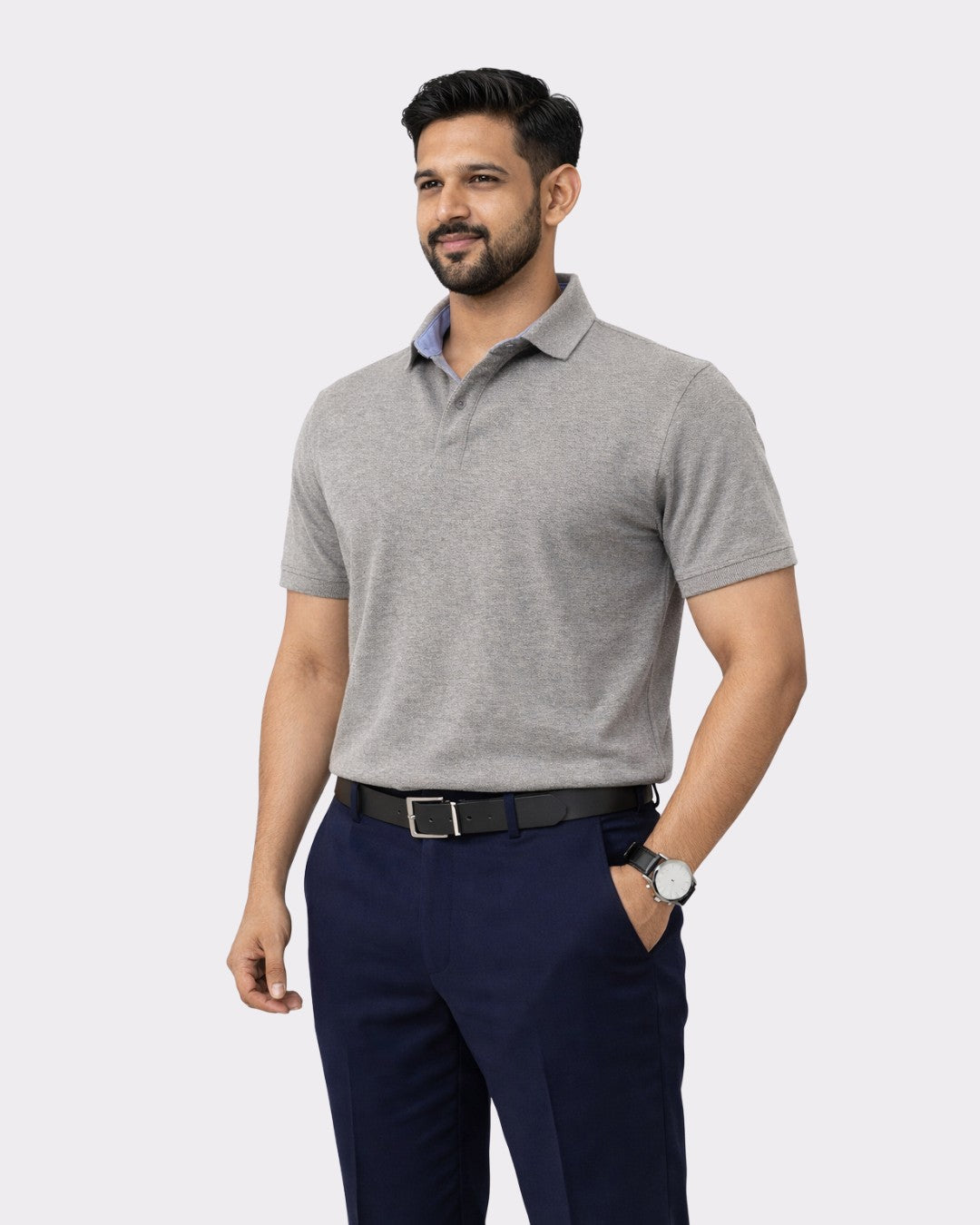 Man wearing Regular Fit Premium Cotton Polo T-Shirt for Men in gray paired with navy pants