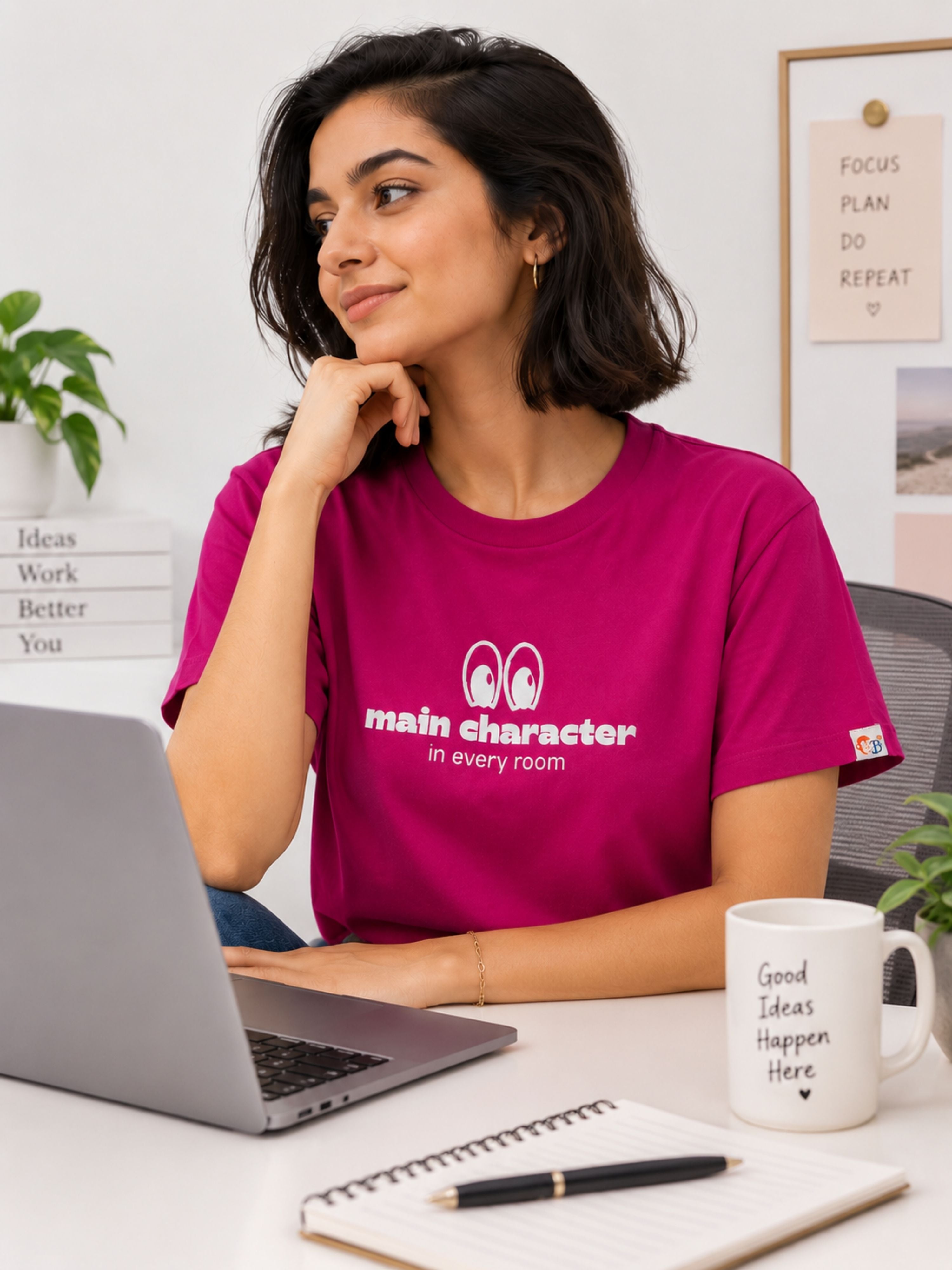 Woman wearing a magenta Regular Fit T-Shirt for Women by Bandar Baant Collections sitting at a desk with laptop and notebook