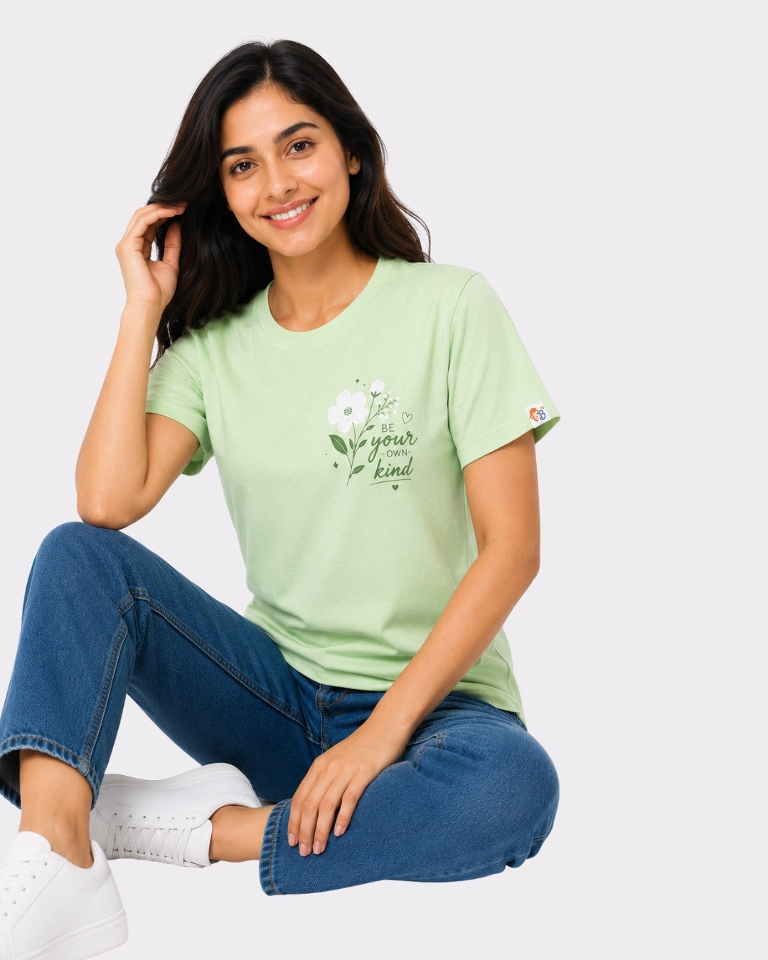 Regular Fit T-Shirt for Women Mint Green with floral print and text be your own kind worn by smiling woman