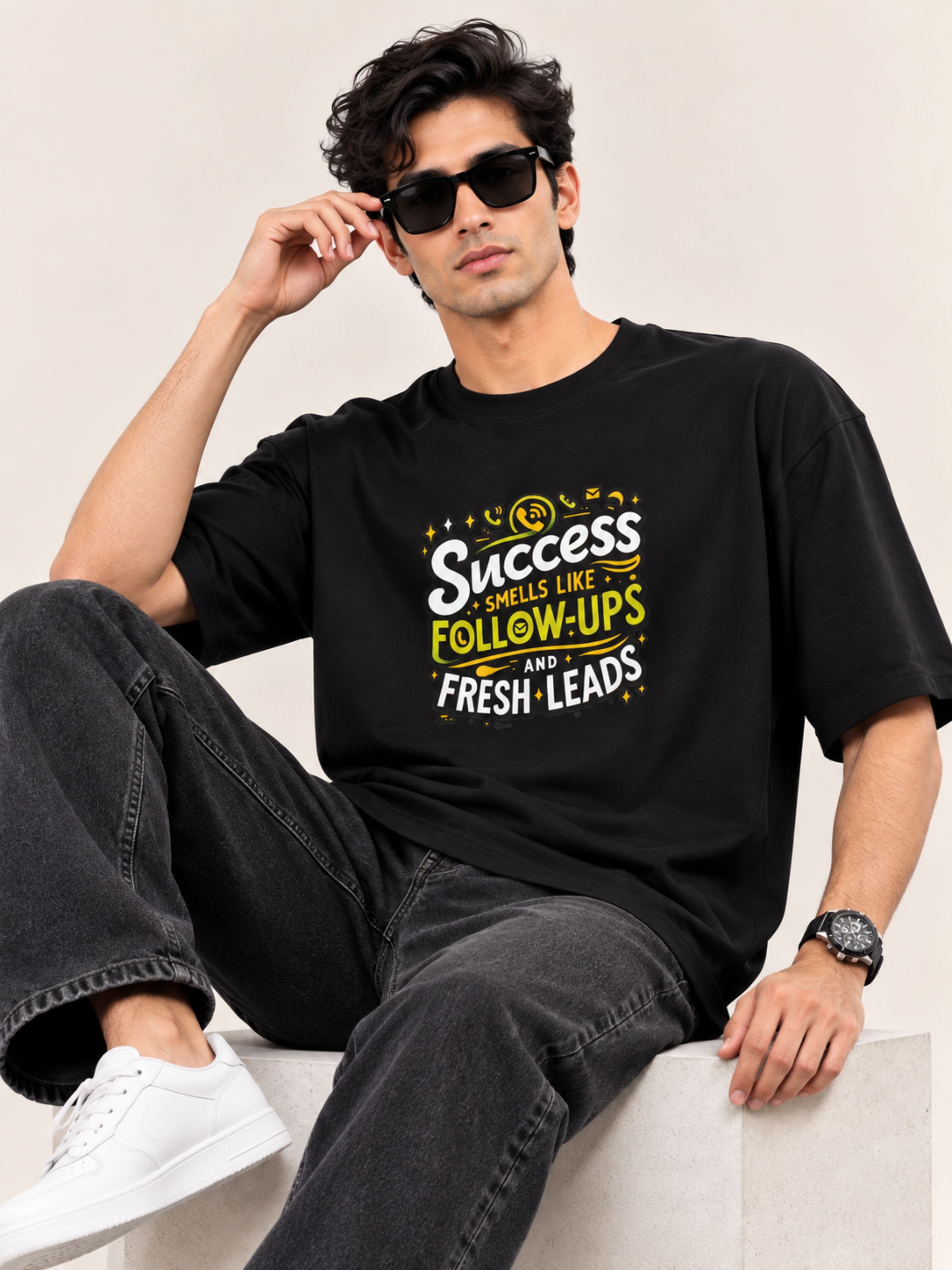Sales Executive Oversized T-shirt For Men black with motivational text worn by man with sunglasses