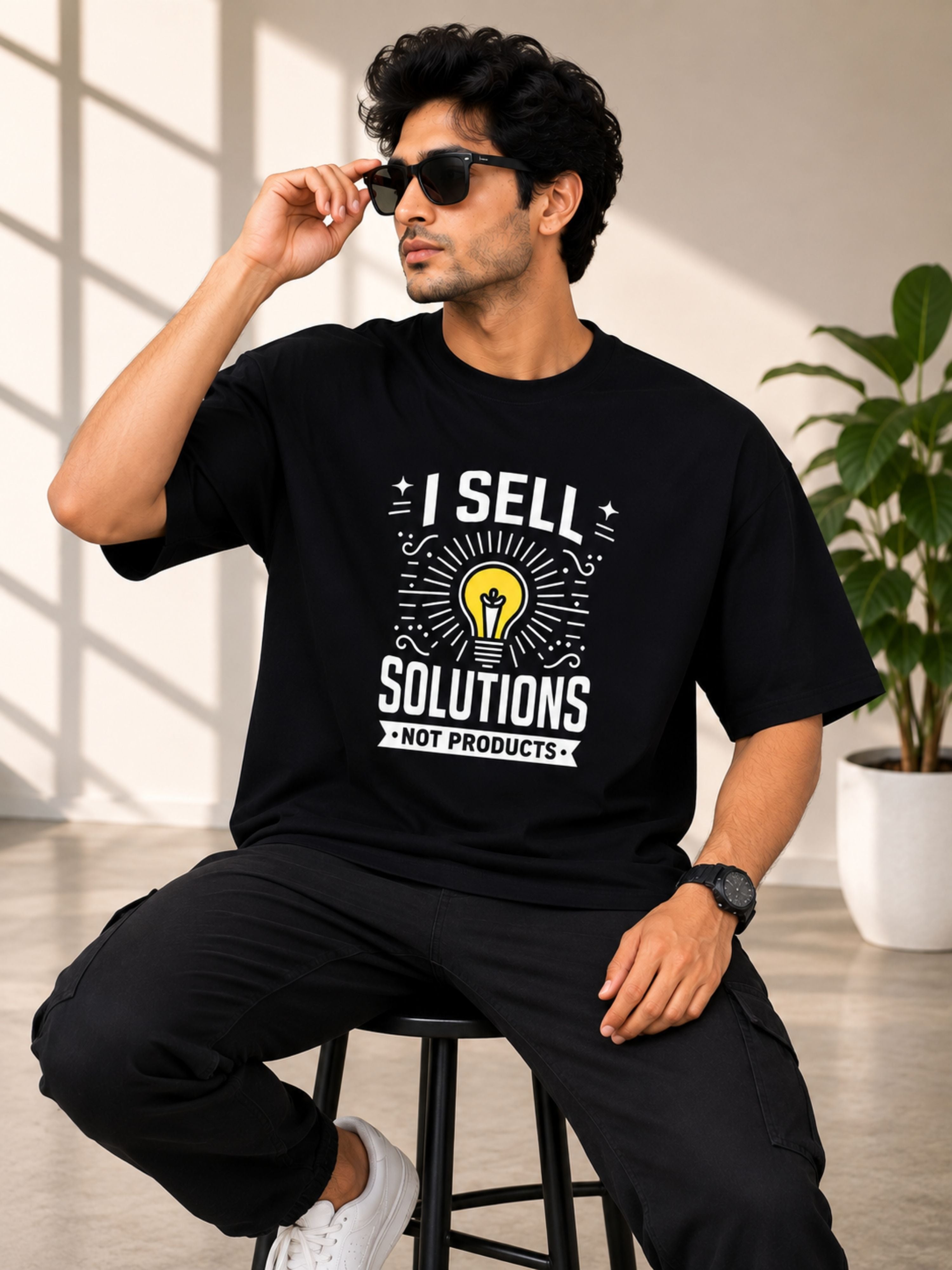 Sales Executive Oversized Tshirt For Men in black with motivational print, worn by a man with sunglasses