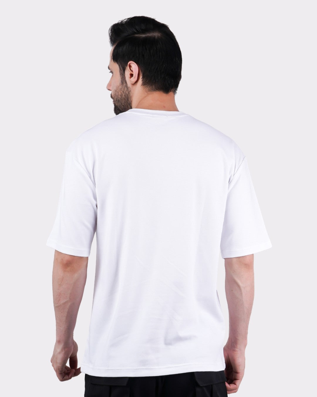 Back view of man wearing Spider Animal Archetype Oversized T-Shirt For Men in white from Bandar Baant Collections