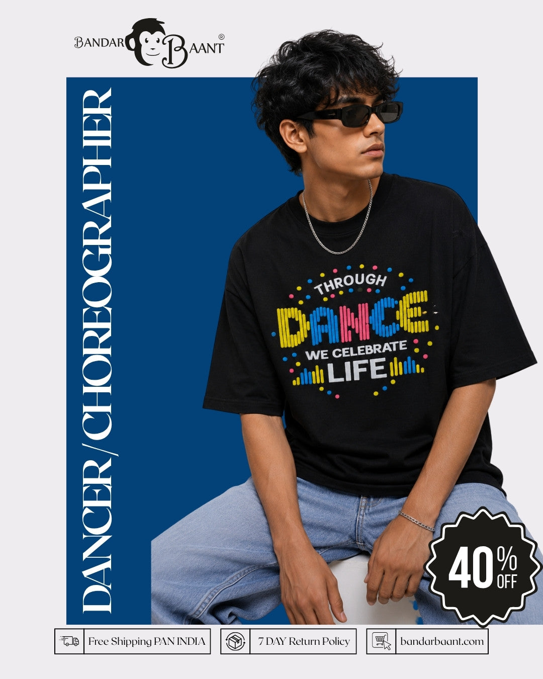 Man wearing black Choreographer Oversized T-shirt For Men with colorful dance print sitting against blue background