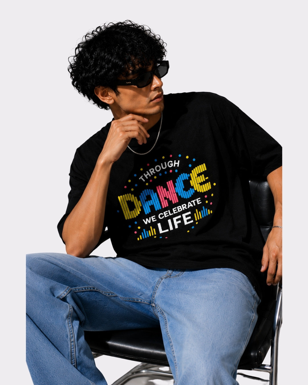 Choreographer Oversized T-shirt For Men black oversized fit t-shirt with colorful dance graphic worn by man