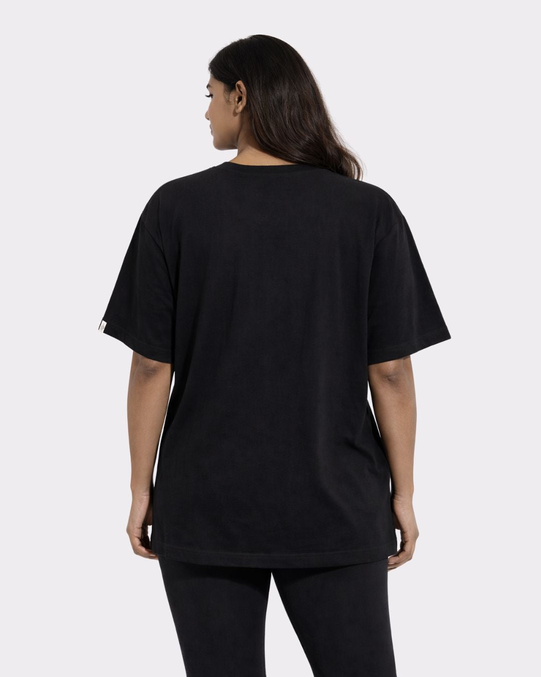 Back view of Gym Enthusiast Oversized Printed T-shirt For Women in black by Bandar Baant Collections