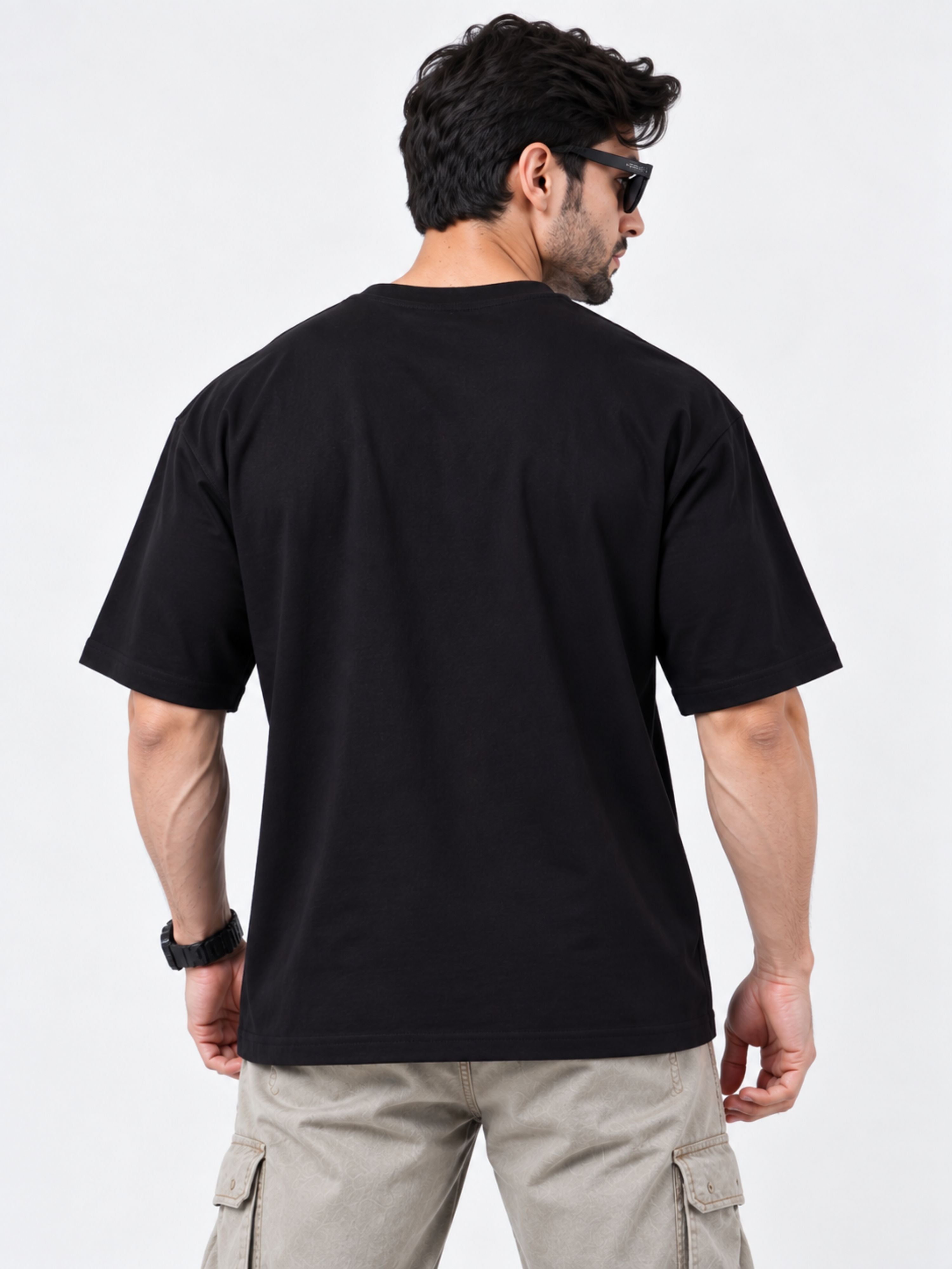 Back view of a man wearing black oversized fit Gym Enthusiast Printed T-shirt For Men by Bandar Baant Collections