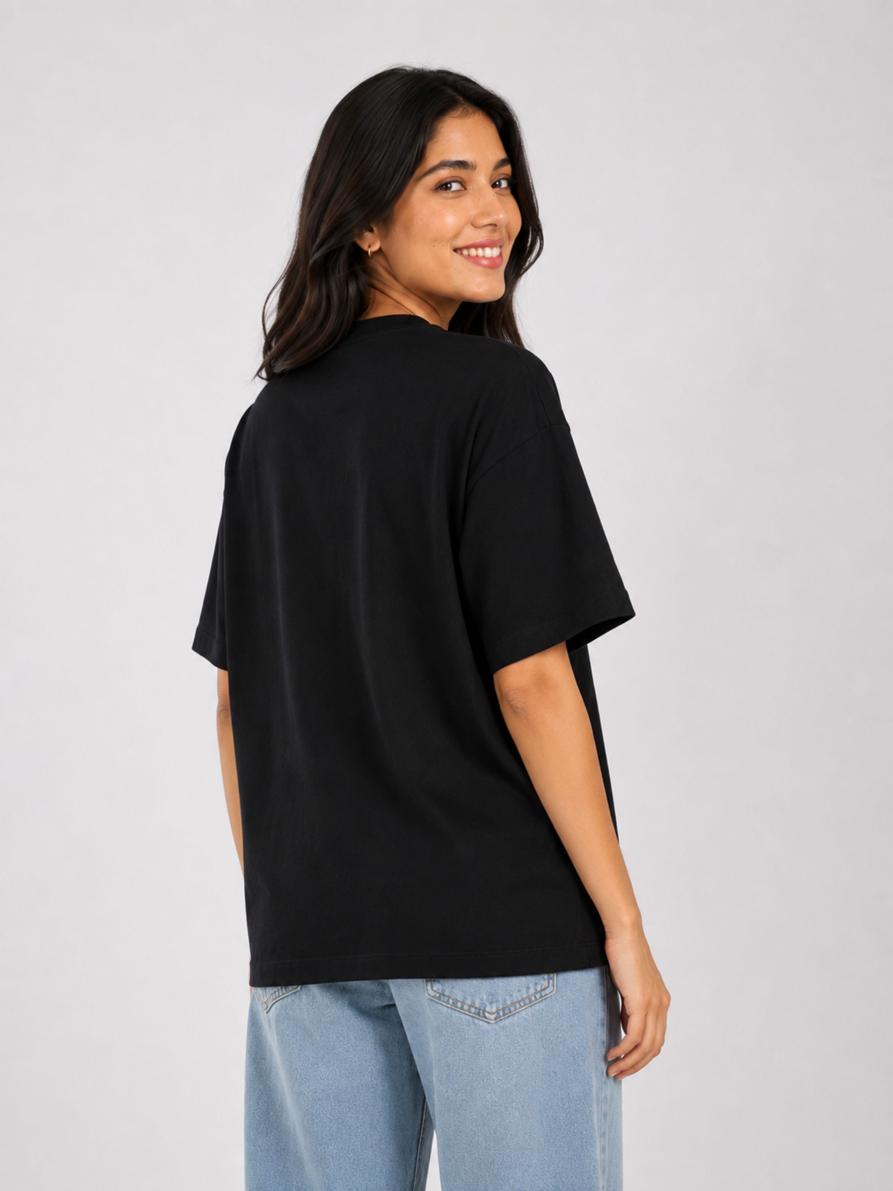 Black oversized fit Journalists T-shirt For Women from Bandar Baant Collections worn by smiling woman