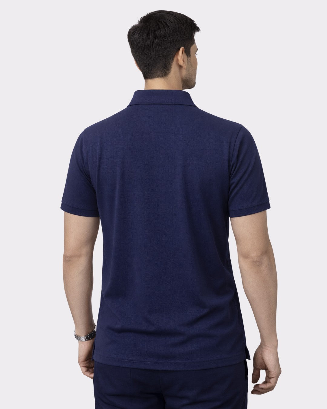 Back view of a man wearing Polo T-shirt For Men Navy Polyster oversized fit from Bandar Baant Collections