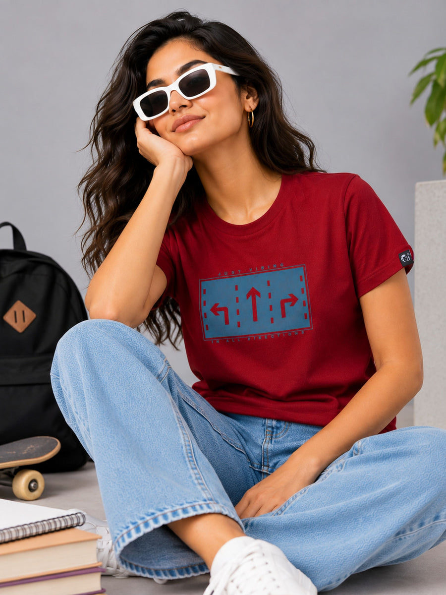 Woman wearing Bandar Baant Collections regular fit t-shirt for women in red with graphic print and casual jeans