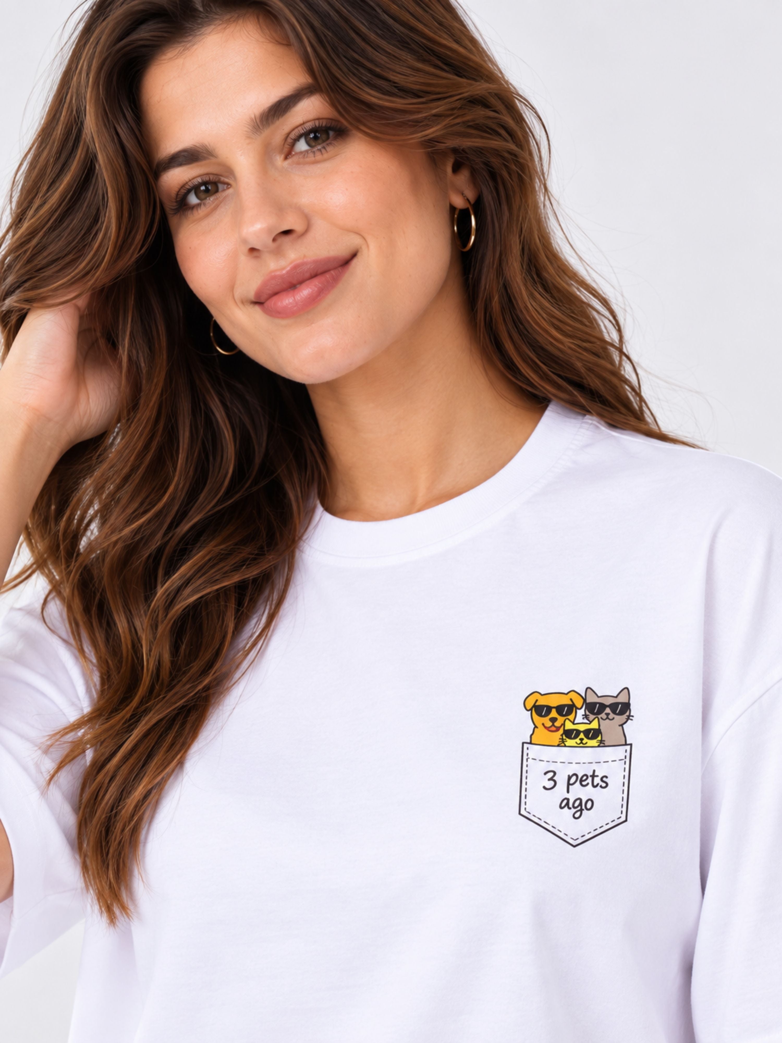White oversized fit Pet Lovers T-shirt For Women featuring a small pocket print of a dog and cat with 3 pets ago text