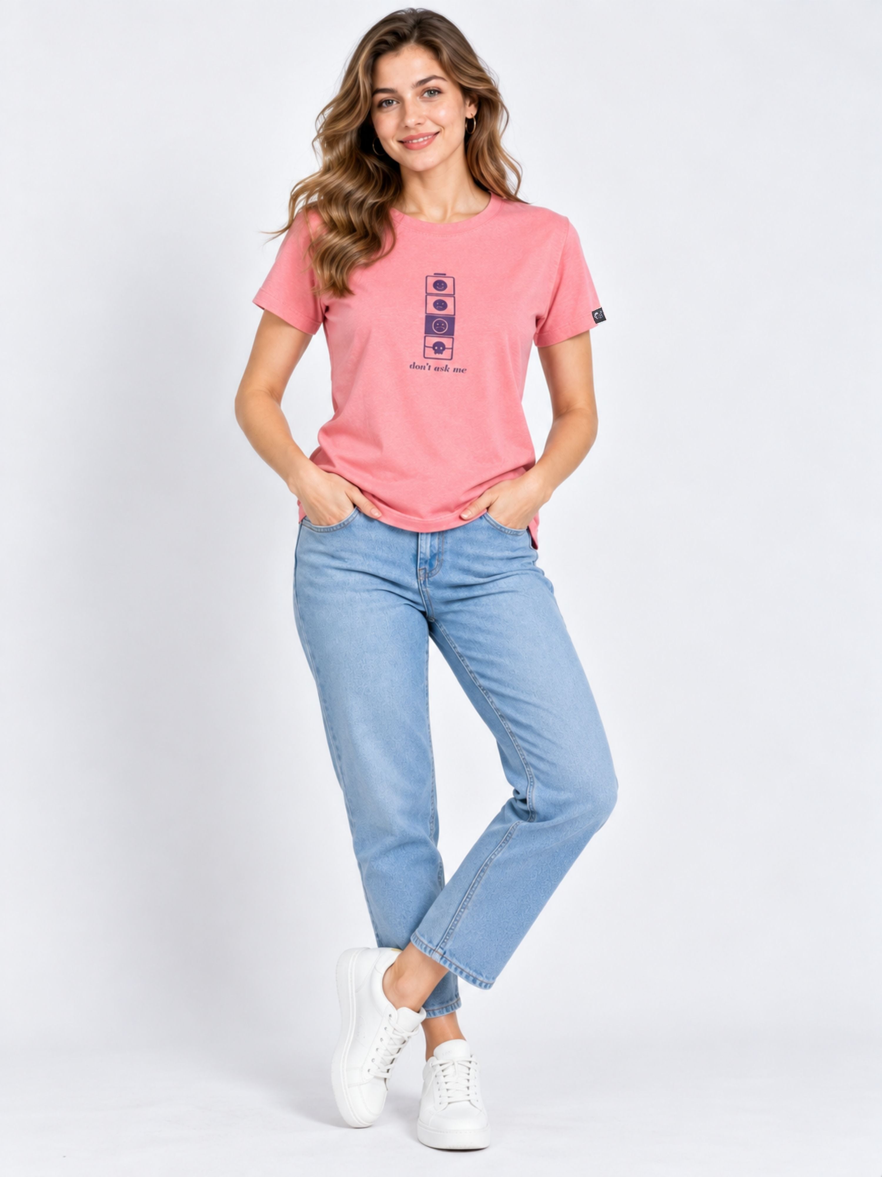 Woman wearing a pink Regular Fit T-shirt For Women from Bandar Baant Collections paired with blue jeans and white sneakers