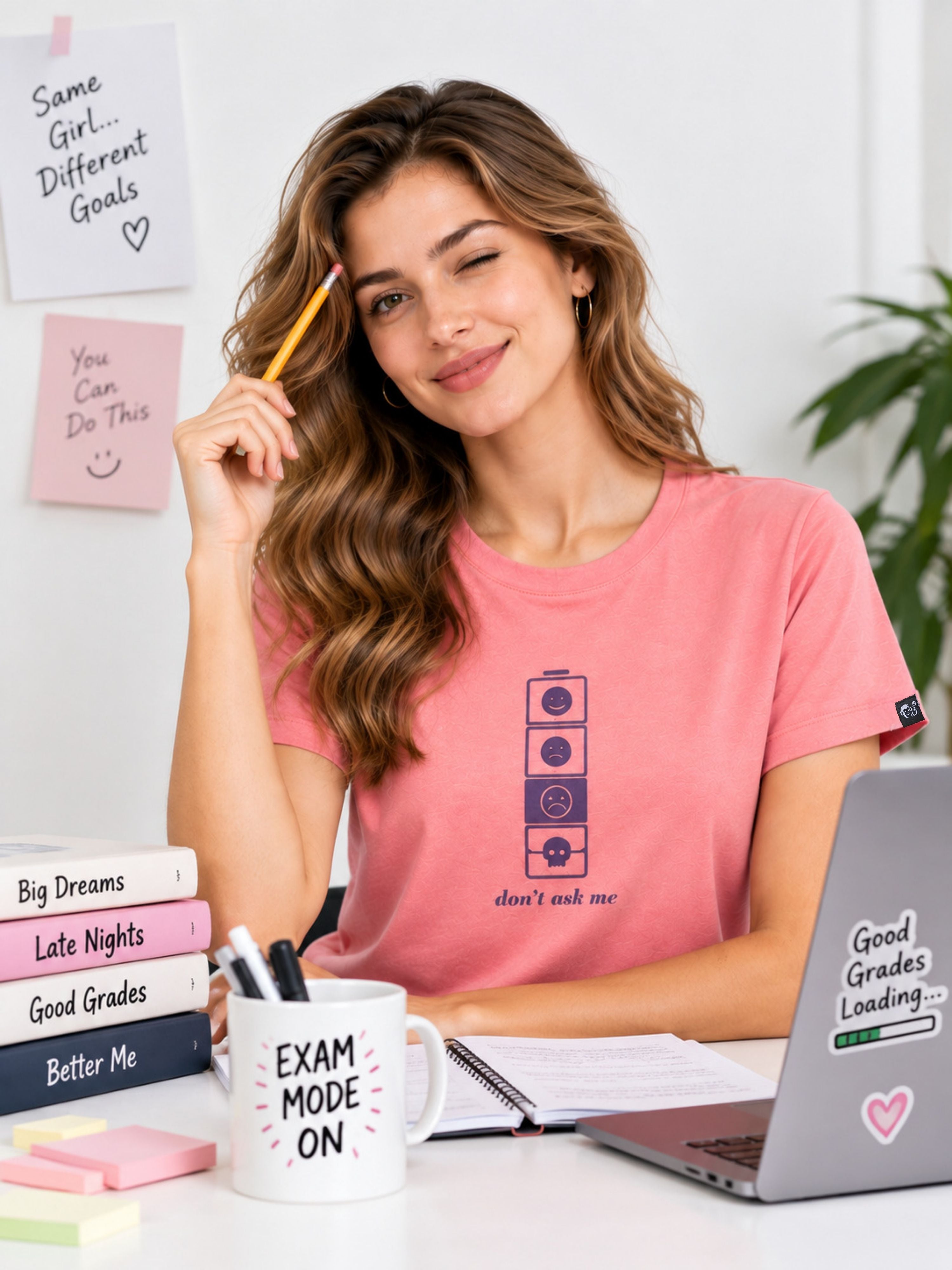 Woman wearing a pink Regular Fit T-shirt For Women by Bandar Baant Collections sitting at a study desk with a laptop and books